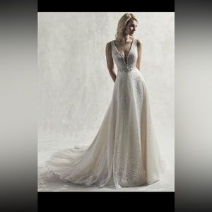 Brand new still with tags. Jarret by Sottero Midgley. Size 12. Never altered.